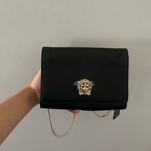 Authentic Versace black coloured leather bag with gold Medusa